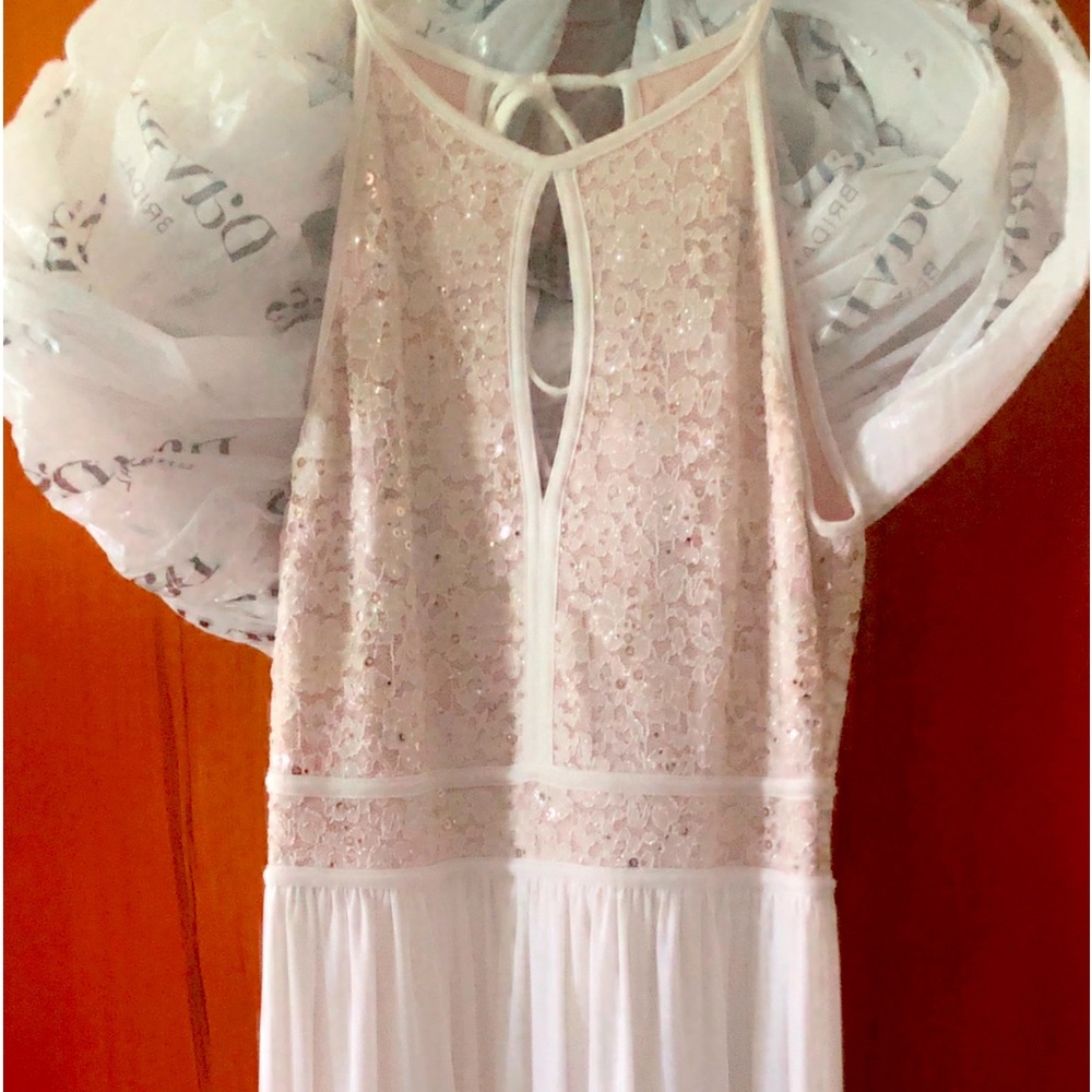 Selling this beautiful dress. I wore it once on my wedding day.